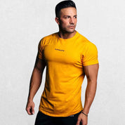 GPW High-Performance Workout T-Shirt in yellow, front view displaying the vibrant color and lightweight, sweat-wicking fabric against a simple studio backdrop.