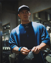 Casual styling of a Dark Blue men’s gym shirt in  GYm background