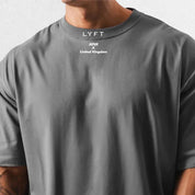 Close-up of premium cotton fabric in a Dark Grey loose-fit gym shirt.