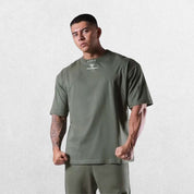 Casual styling of a Forest Green men’s gym shirt in studio background