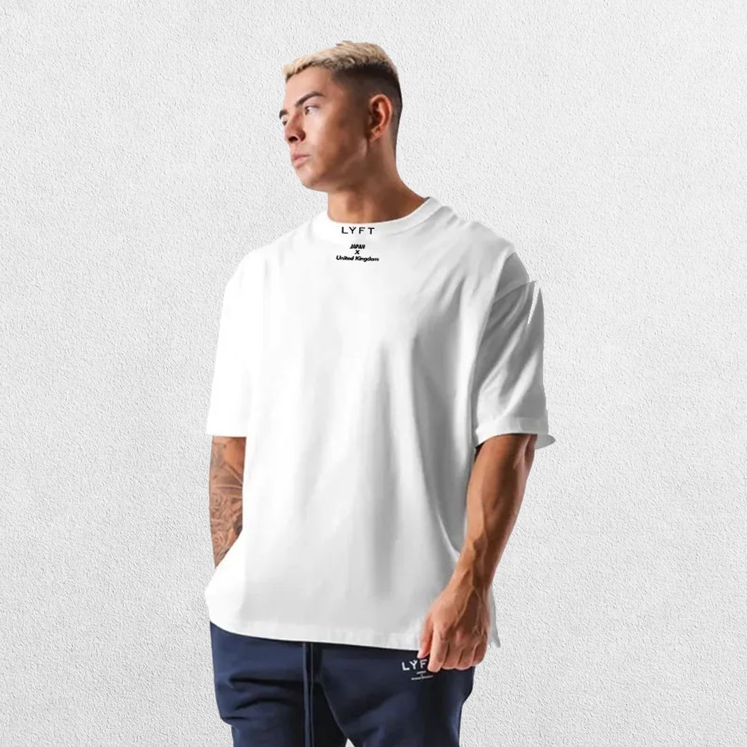 Casual styling of a White men’s gym shirt in studio background