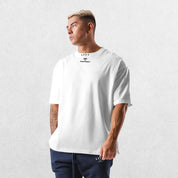 Casual styling of a White men’s gym shirt in studio background