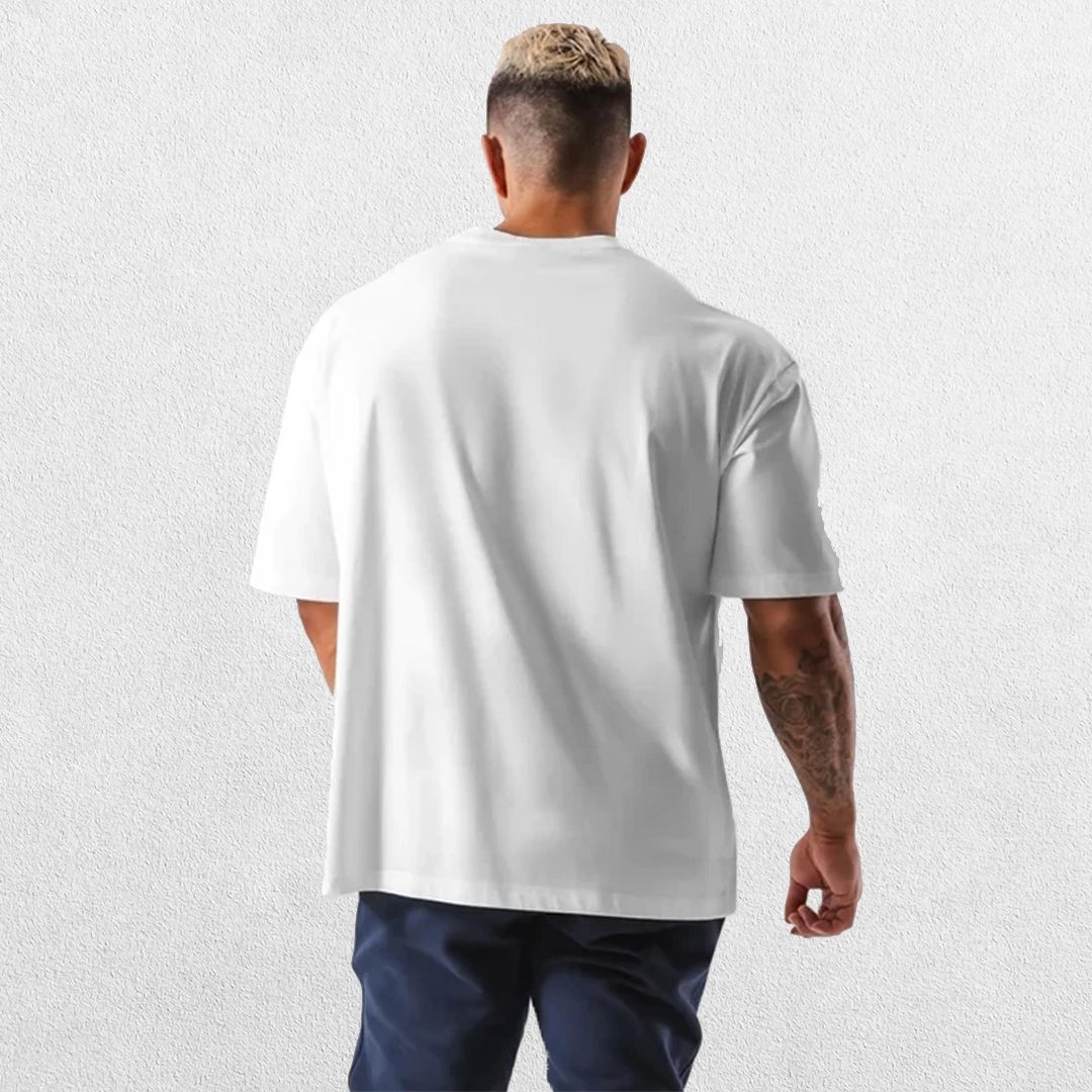 Casual styling of a White men’s gym shirt in studio background