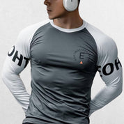 Model in grey tshirt with moisture-wicking, quick-drying fabric for gym workouts and active lifestyle.