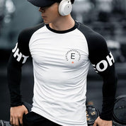 Model wearing white t shirt in gym side profile