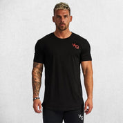 Model wearing black GPW Men's Cotton Slim Fit T-Shirt showcasing athletic fit