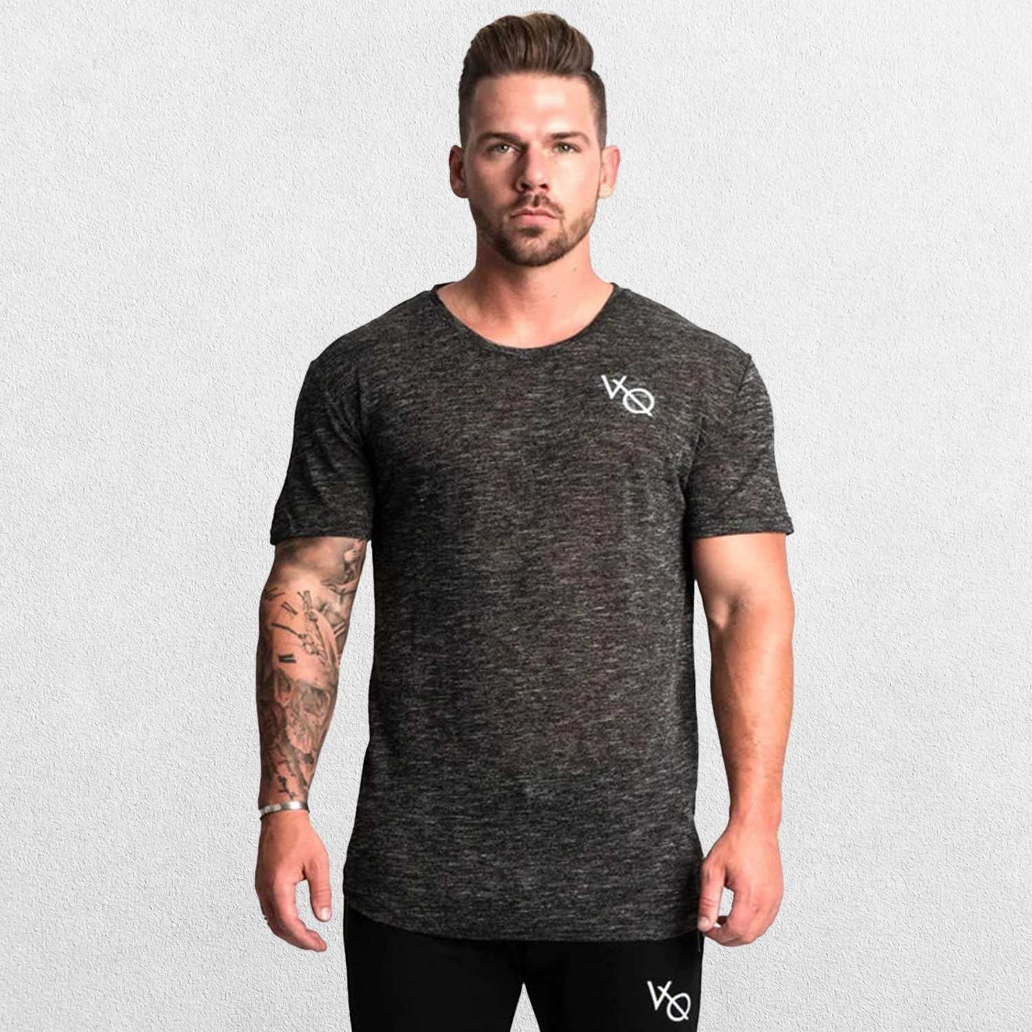 Model wearing dark grey GPW Men's Cotton Slim Fit T-Shirt showcasing athletic fit