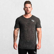 Model wearing dark grey GPW Men's Cotton Slim Fit T-Shirt showcasing athletic fit