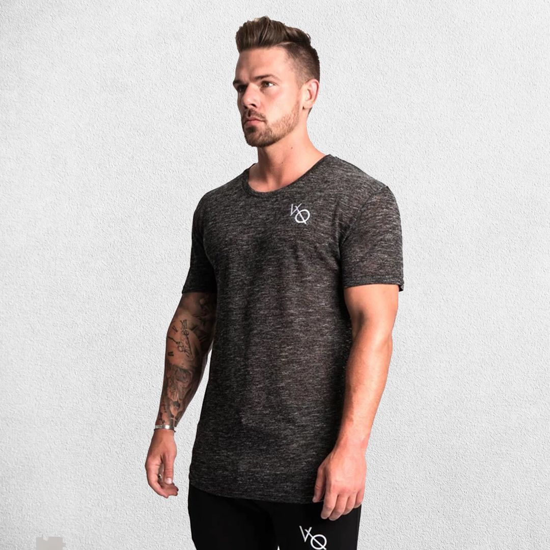 Model wearing Dark Grey GPW Men's Cotton Slim Fit T-Shirt showcasing athletic fit