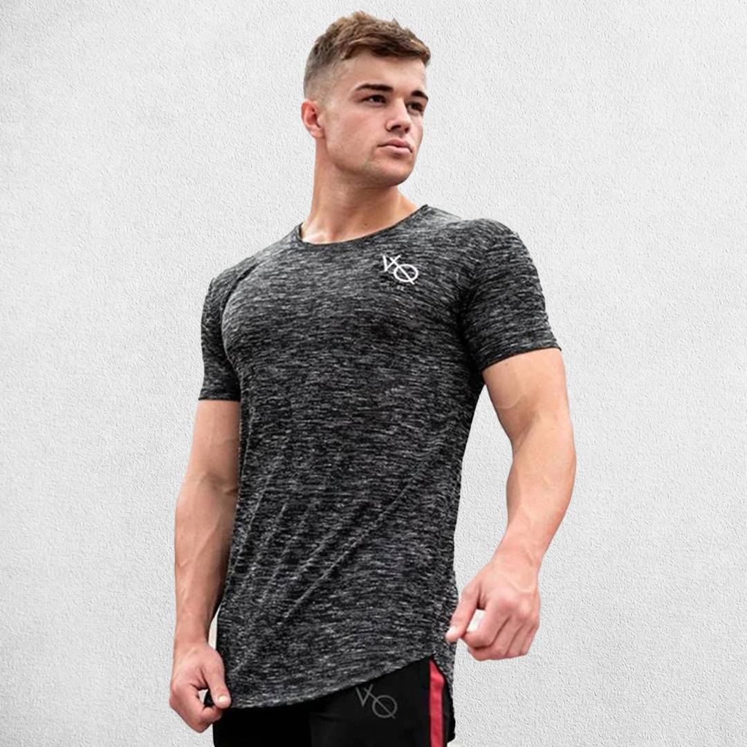 Model wearing Dark Grey GPW Men's Cotton Slim Fit T-Shirt showcasing athletic fit