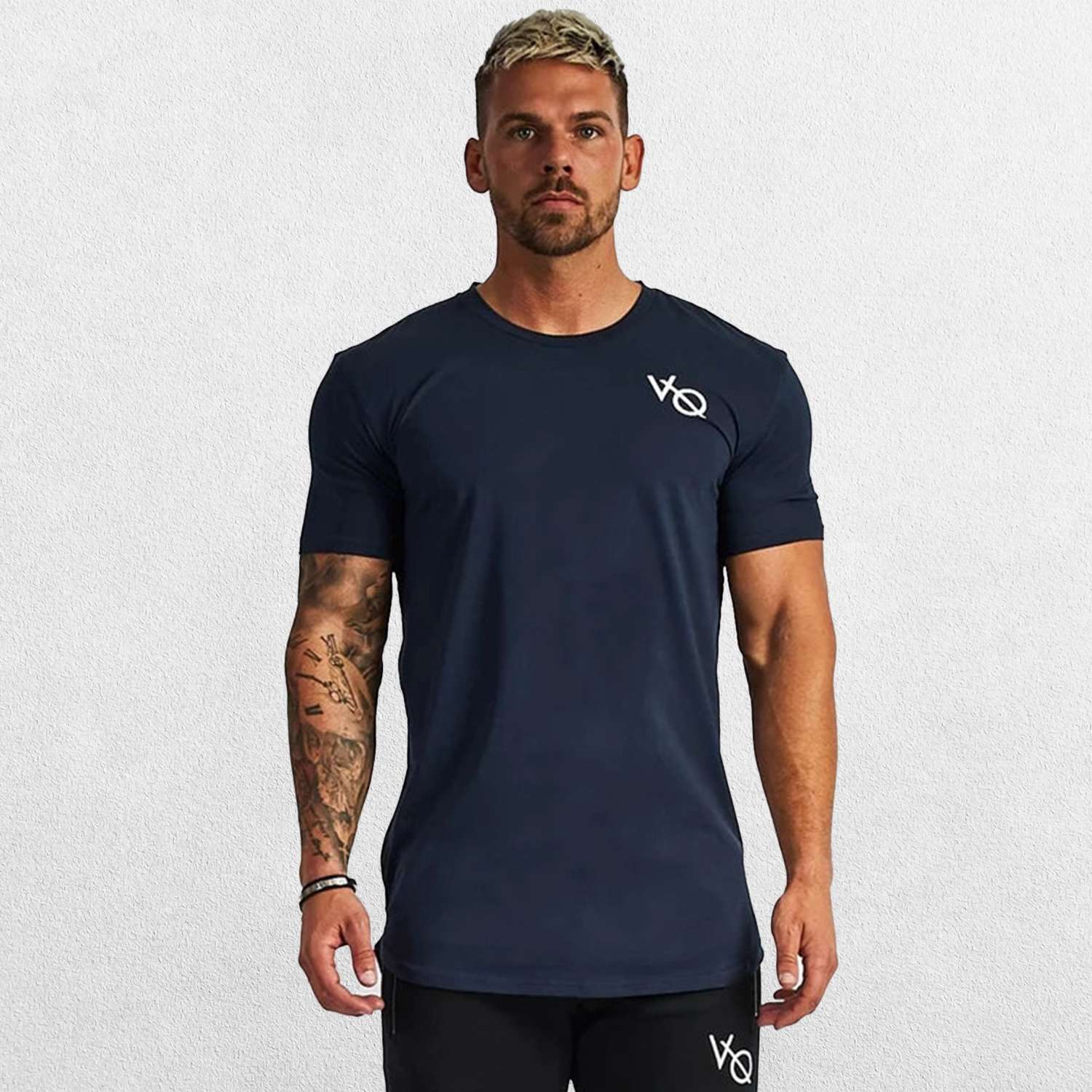 Model wearing blue GPW Men's Cotton Slim Fit T-Shirt showcasing athletic fit