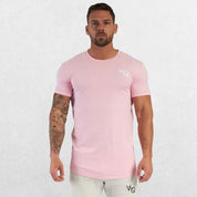 Model wearing pink moisture-wicking GPW slim fit t-shirt