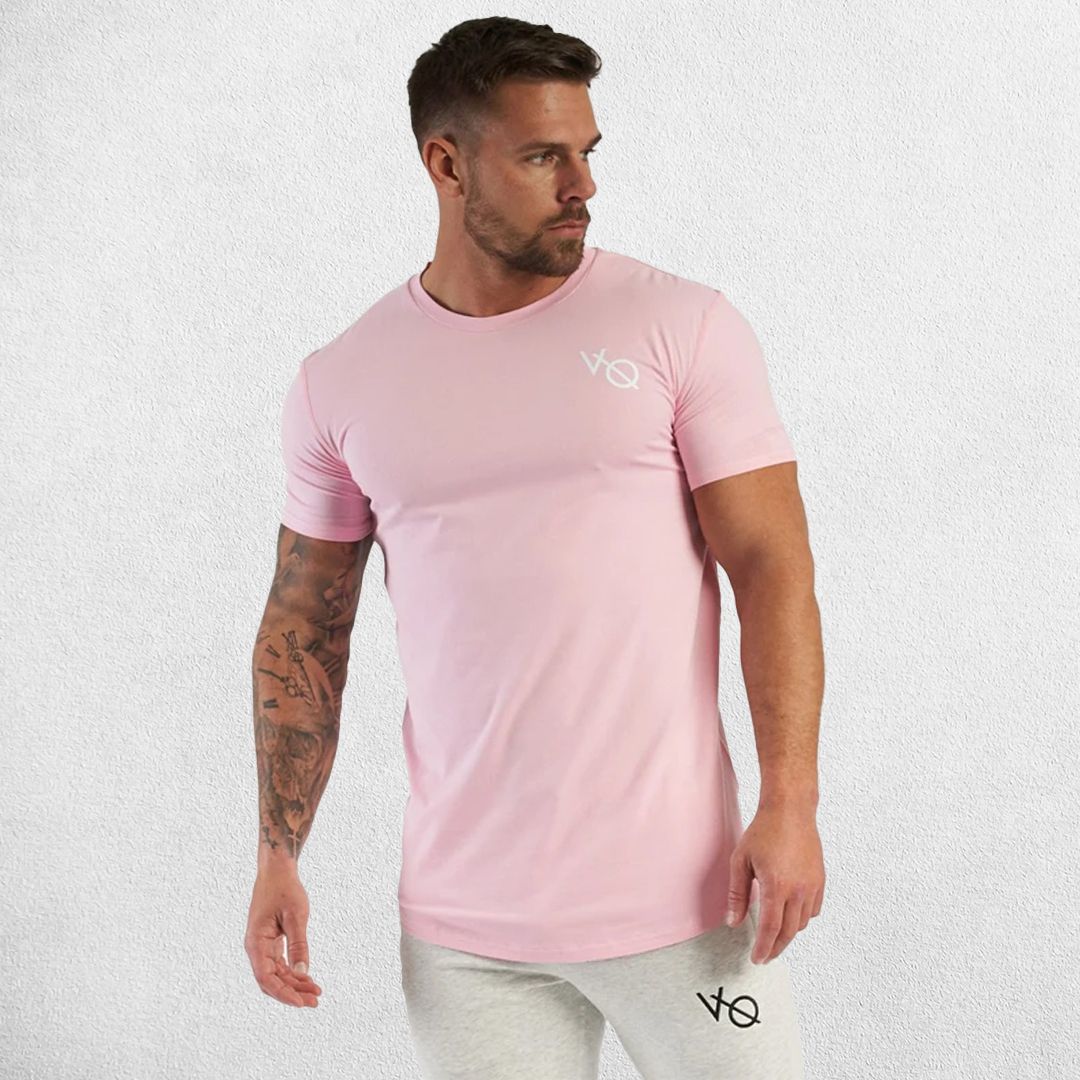 Model wearing pink GPW Men's Cotton Slim Fit T-Shirt showcasing athletic fit