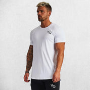 Model wearing white GPW Men's Cotton Slim Fit T-Shirt showcasing athletic fit