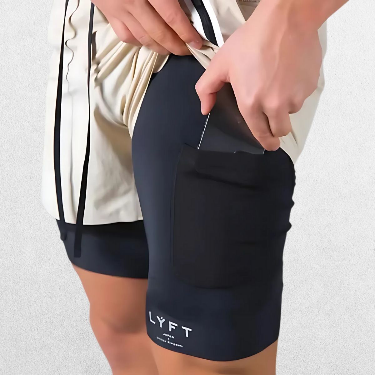 GPW Men's Double-Layered Gym Training Shorts in beige, front view highlighting breathable fabric and modern fit.