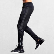 Grey GPW gym joggers with side-colored lines for athletic wear.