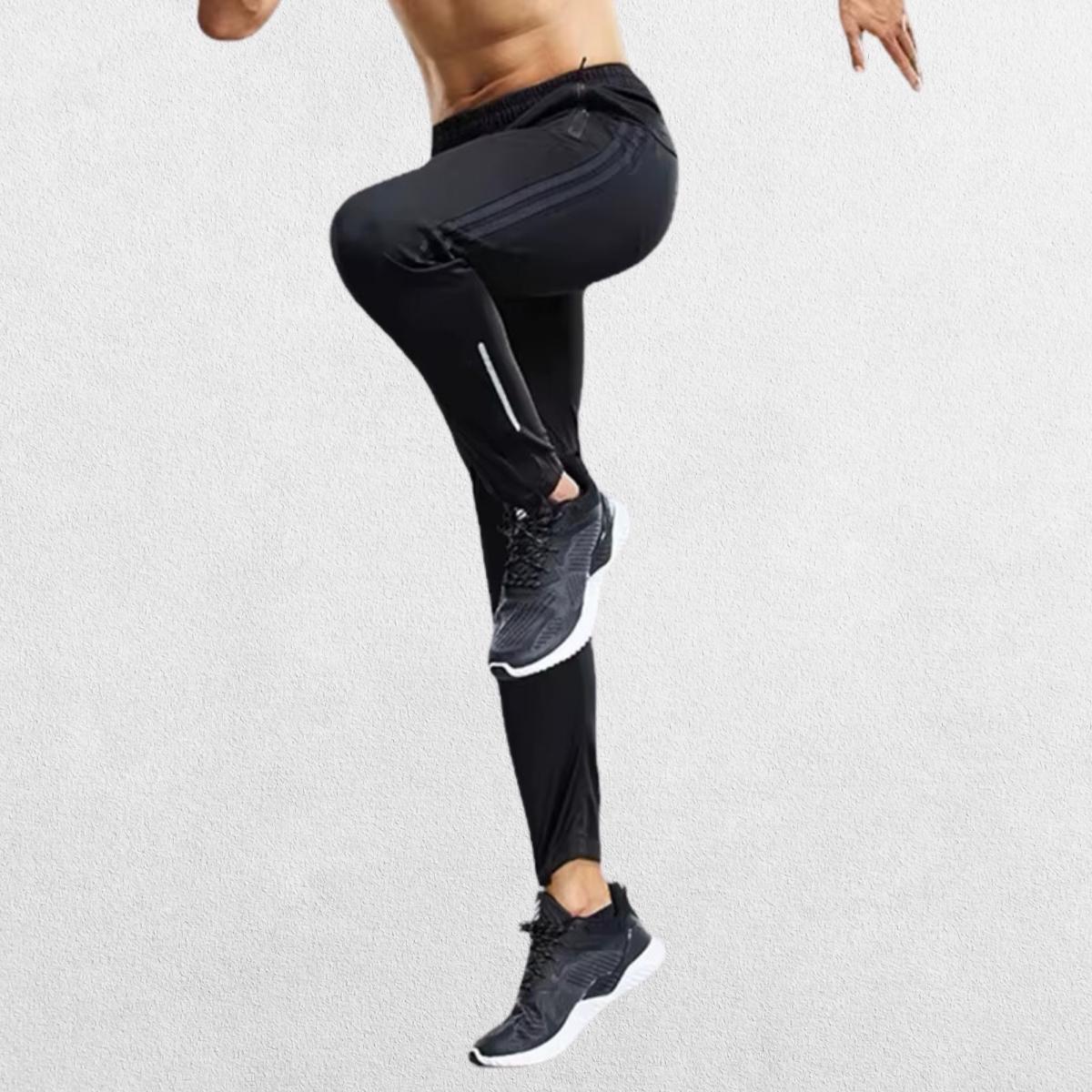 Slim-fit grey GPW joggers with zipper pockets and adjustable cuffs.