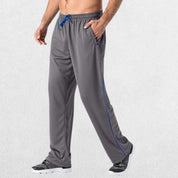 GPW Men’s Lightweight Loose Fit Open Bottom Mesh Athletic Trousers Dark Grey Side View in Studio Background