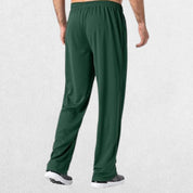 GPW Men’s Lightweight Loose Fit Open Bottom Mesh Athletic Trousers Green Back View in Studio Background