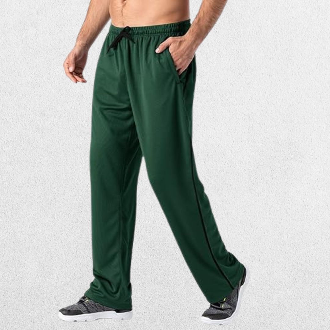 GPW Men’s Lightweight Loose Fit Open Bottom Mesh Athletic Trousers Green Side View in Studio Background.