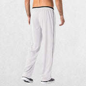 GPW Men’s Lightweight Loose Fit Open Bottom Mesh Athletic Trousers White Back View in Studio Background.