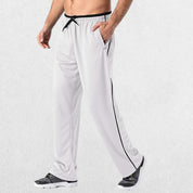 GPW Men’s Lightweight Loose Fit Open Bottom Mesh Athletic Trousers White Side View in Studio Background.