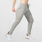 GPW Men's Slim Fit Pencil Pants in grey, front view showcasing the tapered athletic fit and elastic waistband against a clean studio background.