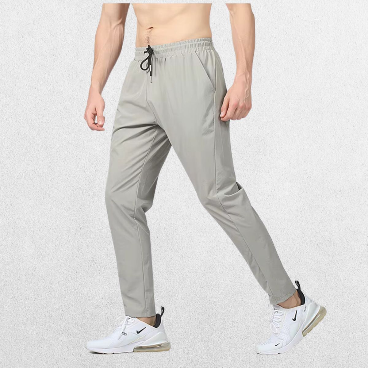 GPW Men's Slim Fit Pencil Pants in grey,  showcasing the tapered athletic fit and elastic waistband against a clean studio background.