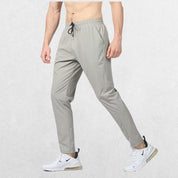 GPW Men's Slim Fit Pencil Pants in grey,  showcasing the tapered athletic fit and elastic waistband against a clean studio background.