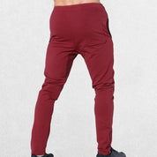 GPW Men’s Slim Fit Zip Athletic Pants Burgundy Back View in Studio Background