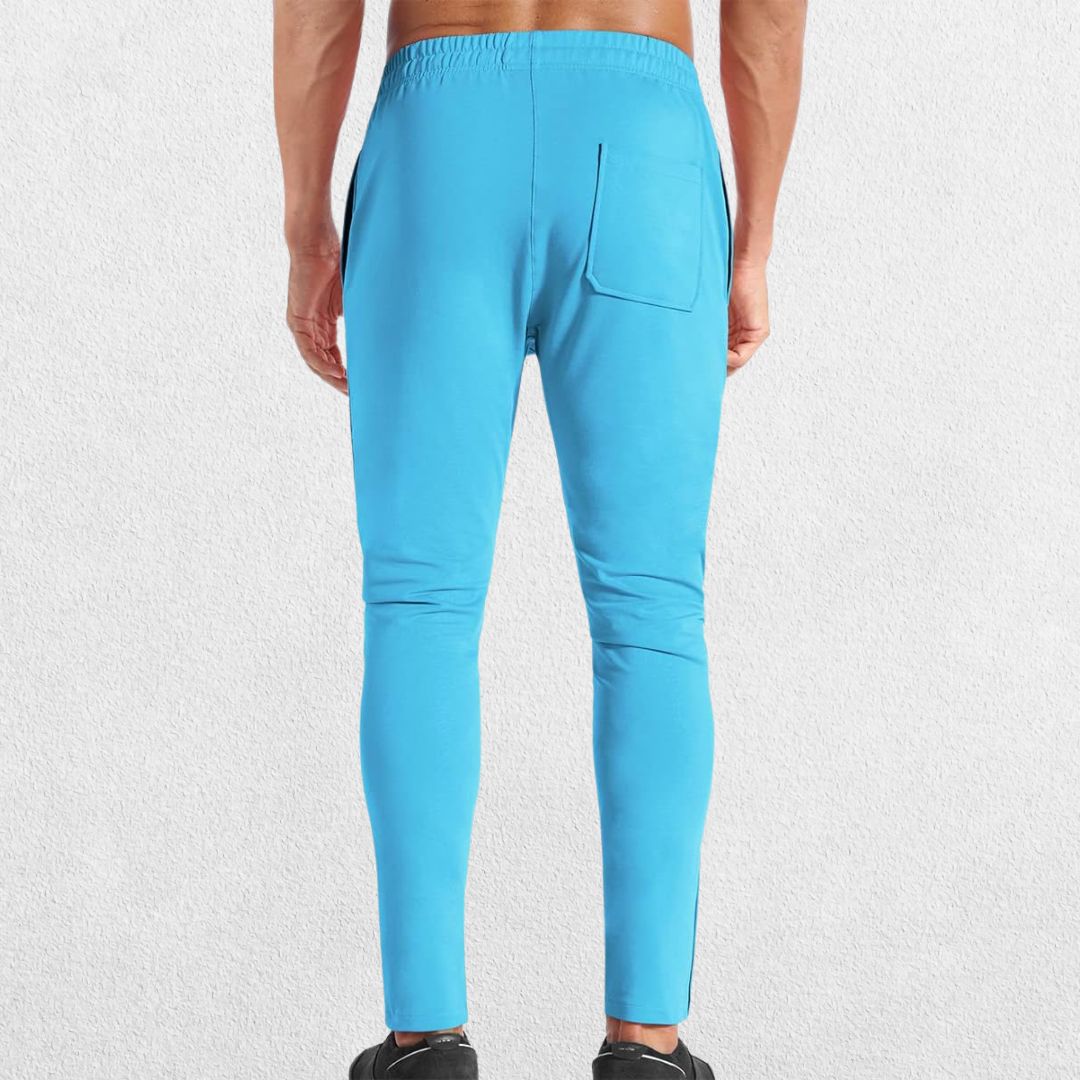 GPW Men’s Slim Fit Zip Athletic Pants Light Blue Back View in Studio Background.