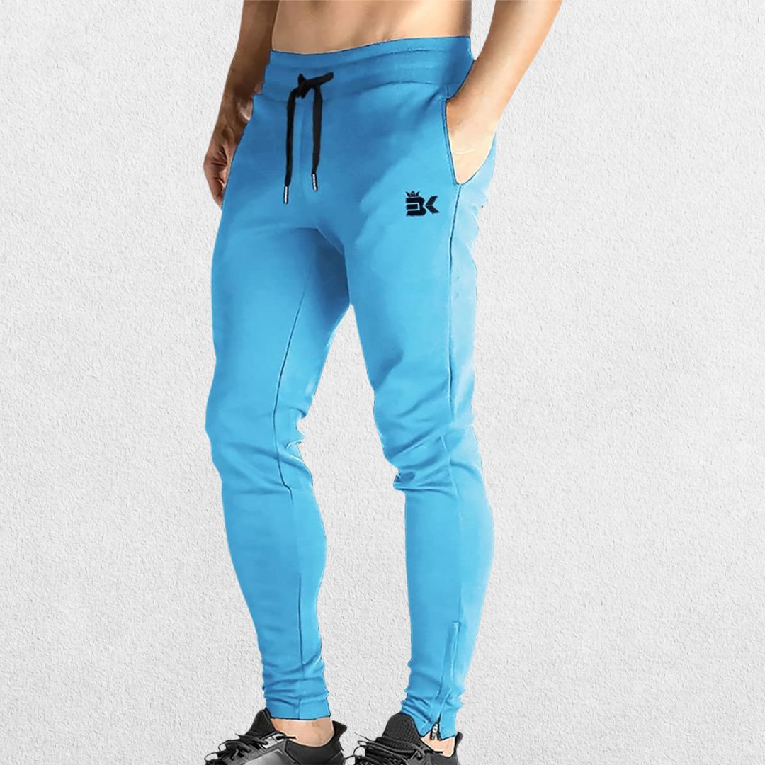 GPW Men’s Slim Fit Zip Athletic Pants Light Blue Front View in Studio Background.