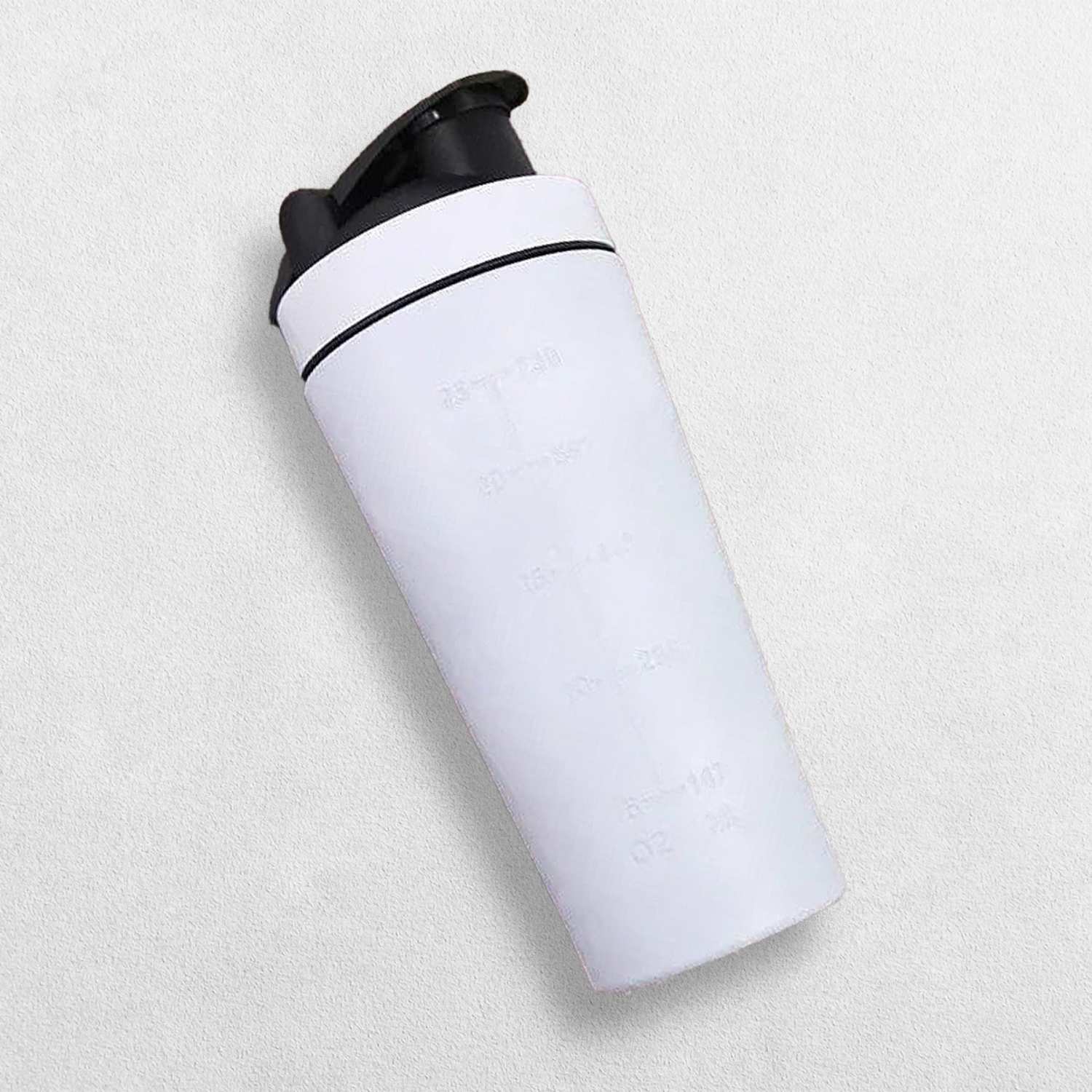 A modern white insulated travel mug with a matte finish, photographed in a studio with soft lighting for a clean and elegant look.