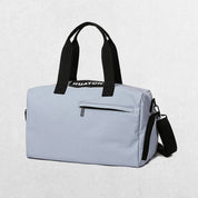Grey Stylish gym bag in a studio setting.