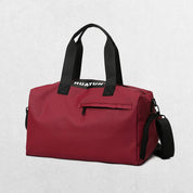 Red Stylish gym bag in a studio setting.