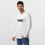 Model styling the GPW White Unbreakable Tee with casual pants.