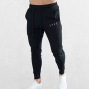 GPW men’s black breathable pants with logo for workouts and casual wear.