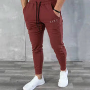 Lifestyle image of GPW men’s rose red joggers, blending vibrant color with sporty comfort.