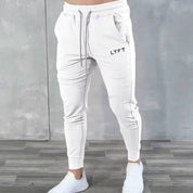 Model in GPW men’s white breathable joggers for an athletic style