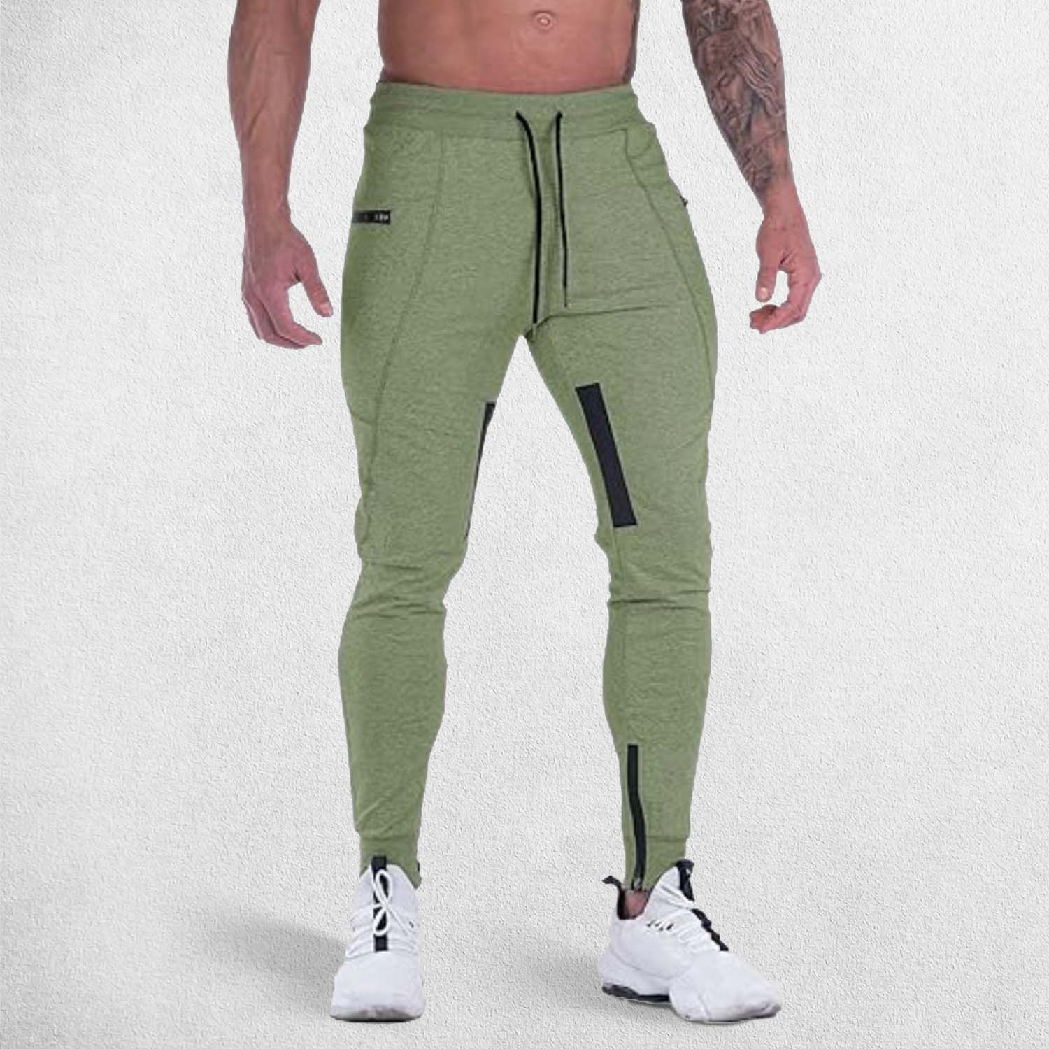 Adjustable waistband strap of Green GPW gym trousers being customized for a perfect fit.