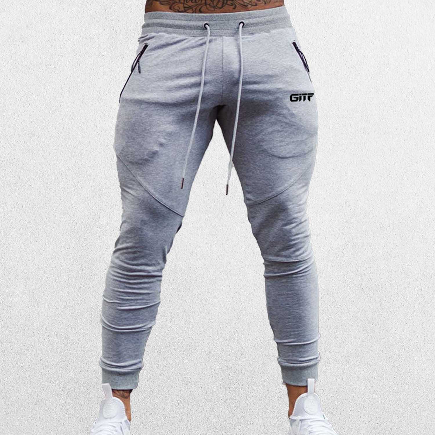 Close up of Model Wearing Grey Breathable Men’s Training Joggers with Adjustable Drawstring and Secure Pockets