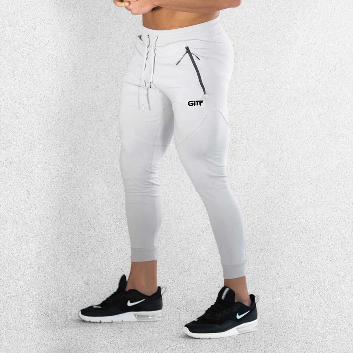 Side View Of Model Wearing Grey Breathable Men’s Training Joggers with Adjustable Drawstring