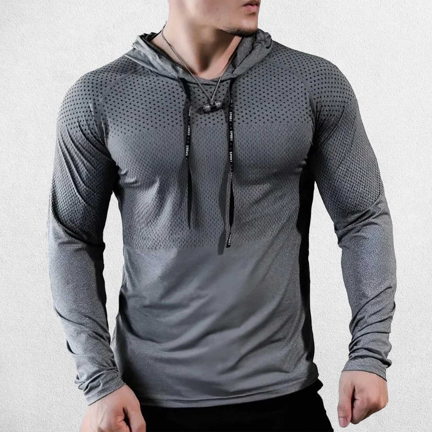 Model wearing Grey men’s slim-fit hooded sports top in action during fitness training.