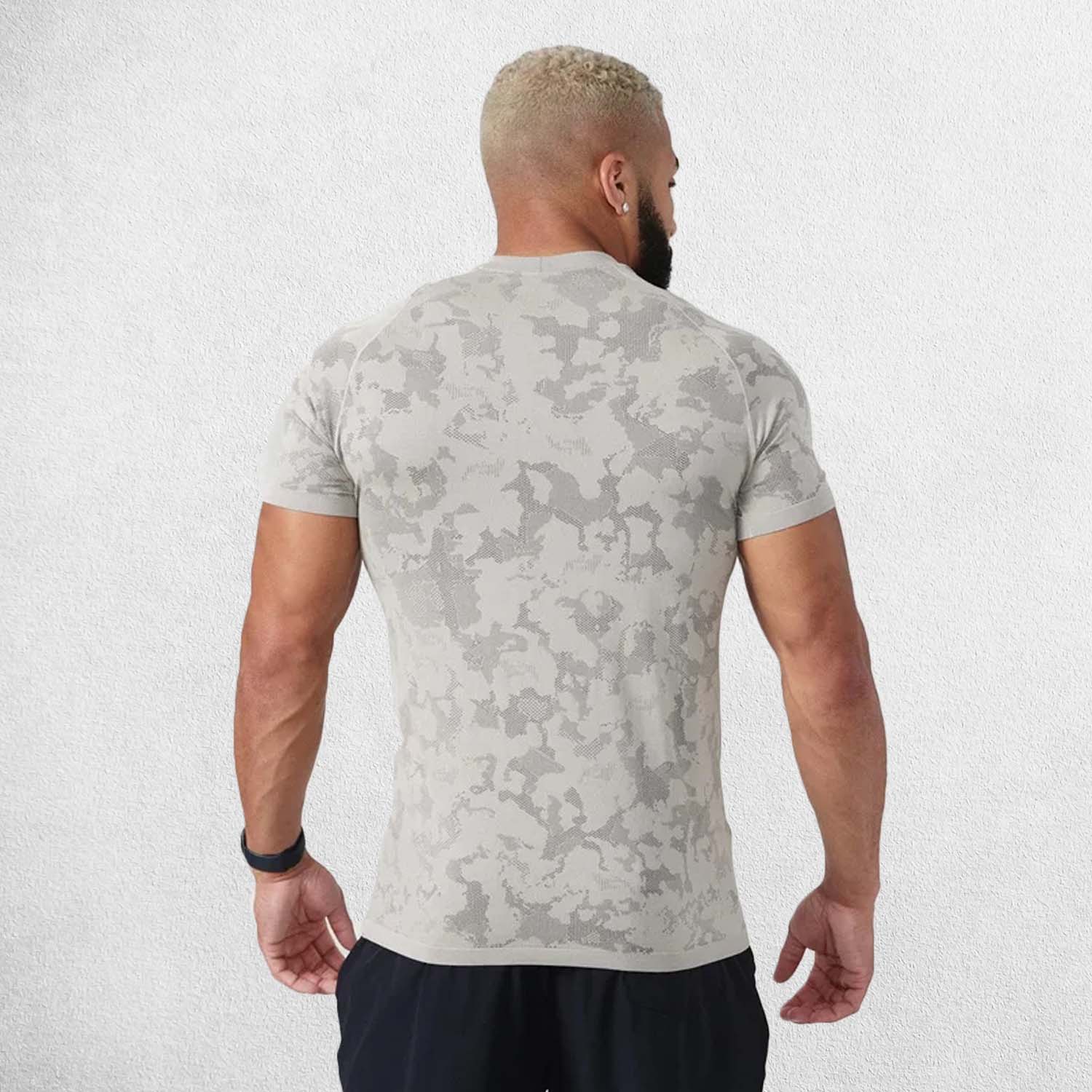 Back view of the shirt, highlighting its compression fit and moisture-wicking design for intense workouts.