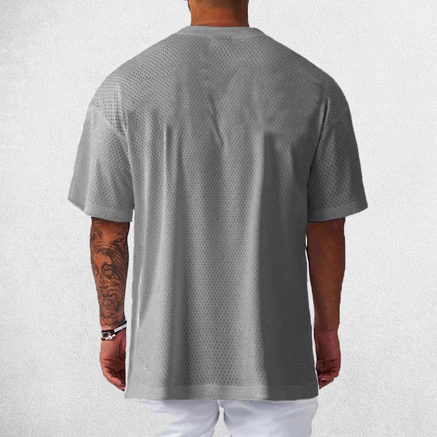 Back View of Model Wearing Grey Men’s Short Sleeve Quick Dry Oversized Mesh Gym T-Shirt – Breathable, Quick-Dry Fitness Tee