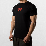 Black Gym Junky Men’s Slim Fit T-Shirt, angled slightly left, showing the bold graphic and tailored fit.