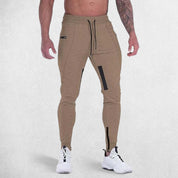 Front view of model wearing Khaki GPW Men's Slim Fit Trousers with Zipper Pockets for Training