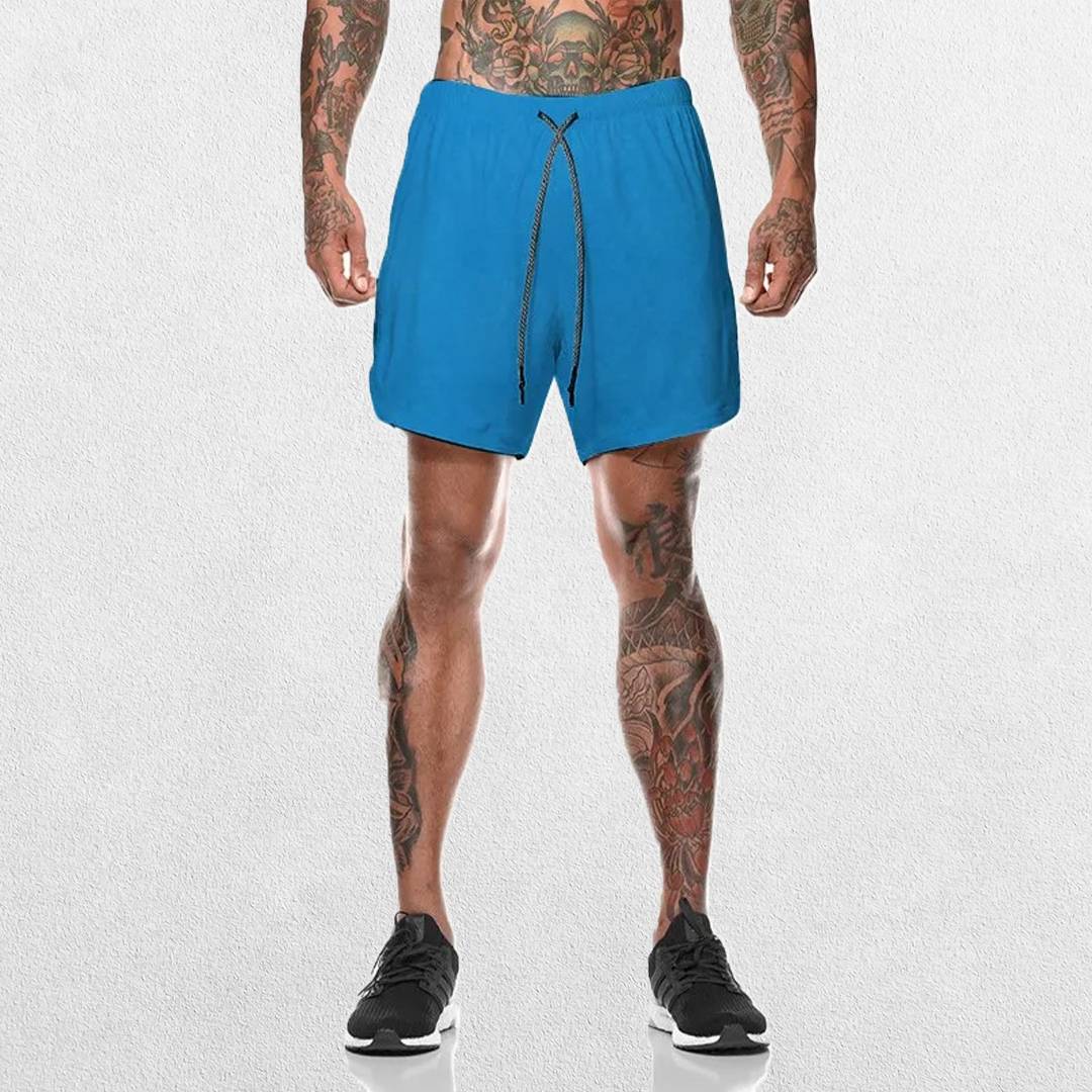 Front view of Model wearing Light Blue GPW Men's 2-in-1 Running Shorts for Gym & Fitness Workouts