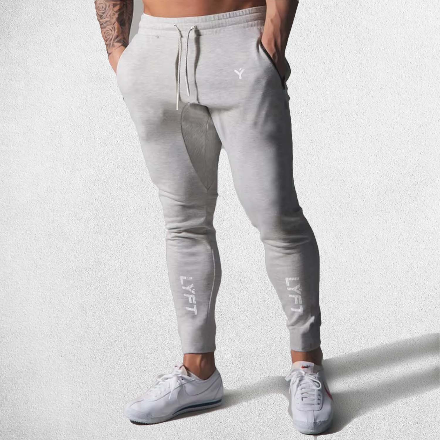 Model Wearing Light Grey Men’s Fitness Workout Cotton Skinny Joggers for Running, Fitness & Bodybuilding