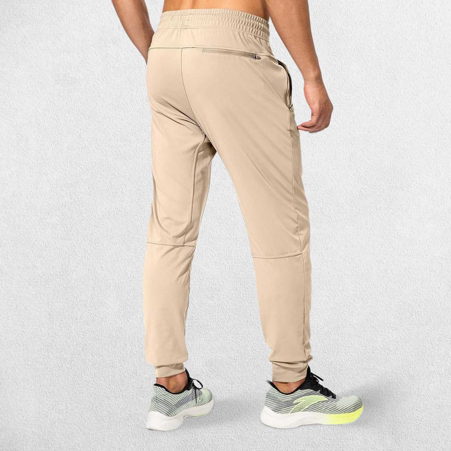 Rear view of Light Khaki GPW Men's Sweatpants showcasing their flexible and comfortable fit.